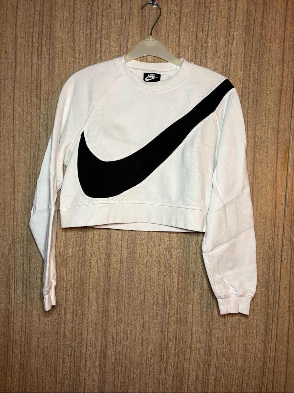 Nike Women's White Cropped Sweatshirt with Large Black Swoosh Accent